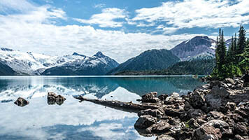 Feel the freshness of outdoors from your PC with the Mountain Lake wallpaper. If you like mountains and lakes, get this free Mountain Lake wallpaper on your homepage.